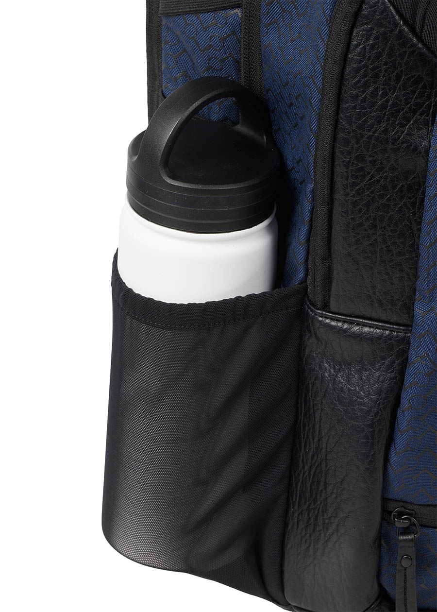 Close-up of the Kerrits EQ Backpack, showing the side mesh bottle compartment to make sure you stay hydrated.