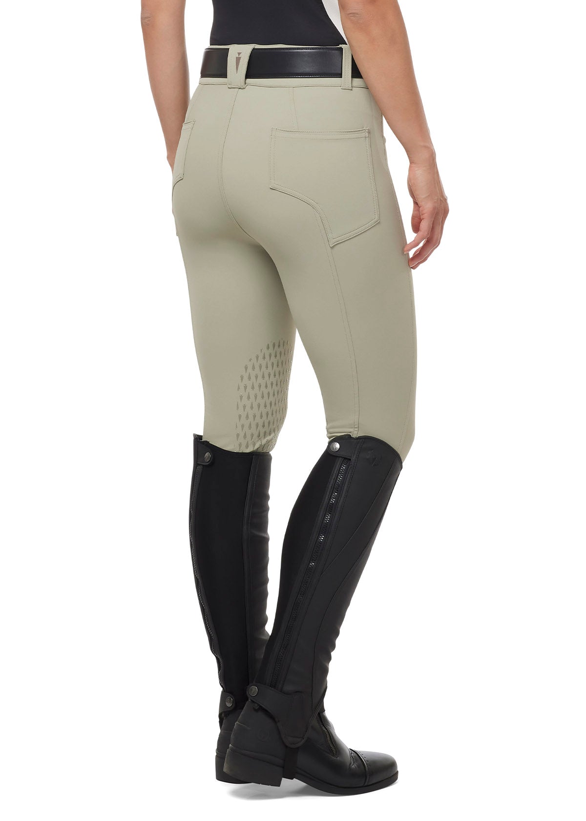 Back view of a model wearing the Kerrits K-Flex™ Knee Patch Breech in Sand, highlighting the flattering fit and smooth waistband.