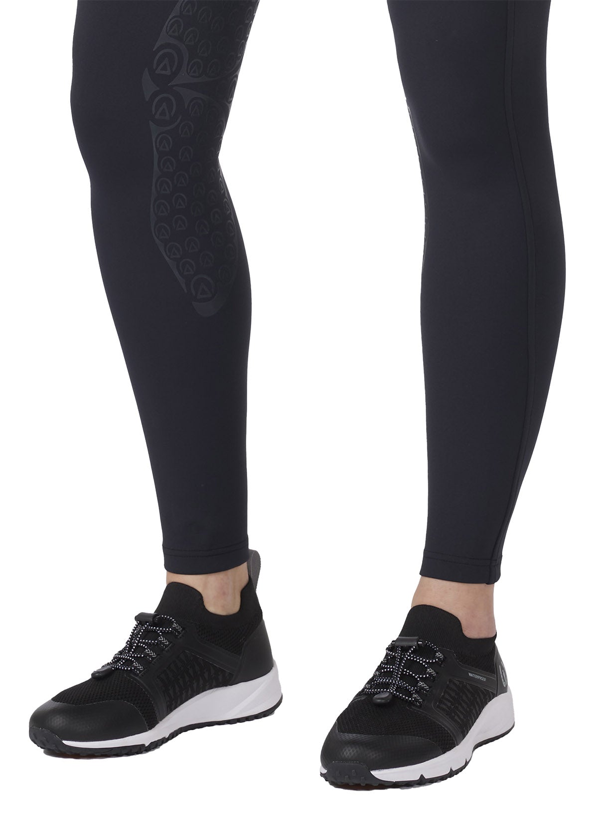 Detailed view of the Affinity® Silicone knee patch on the tight, providing flexible, breathable grip.