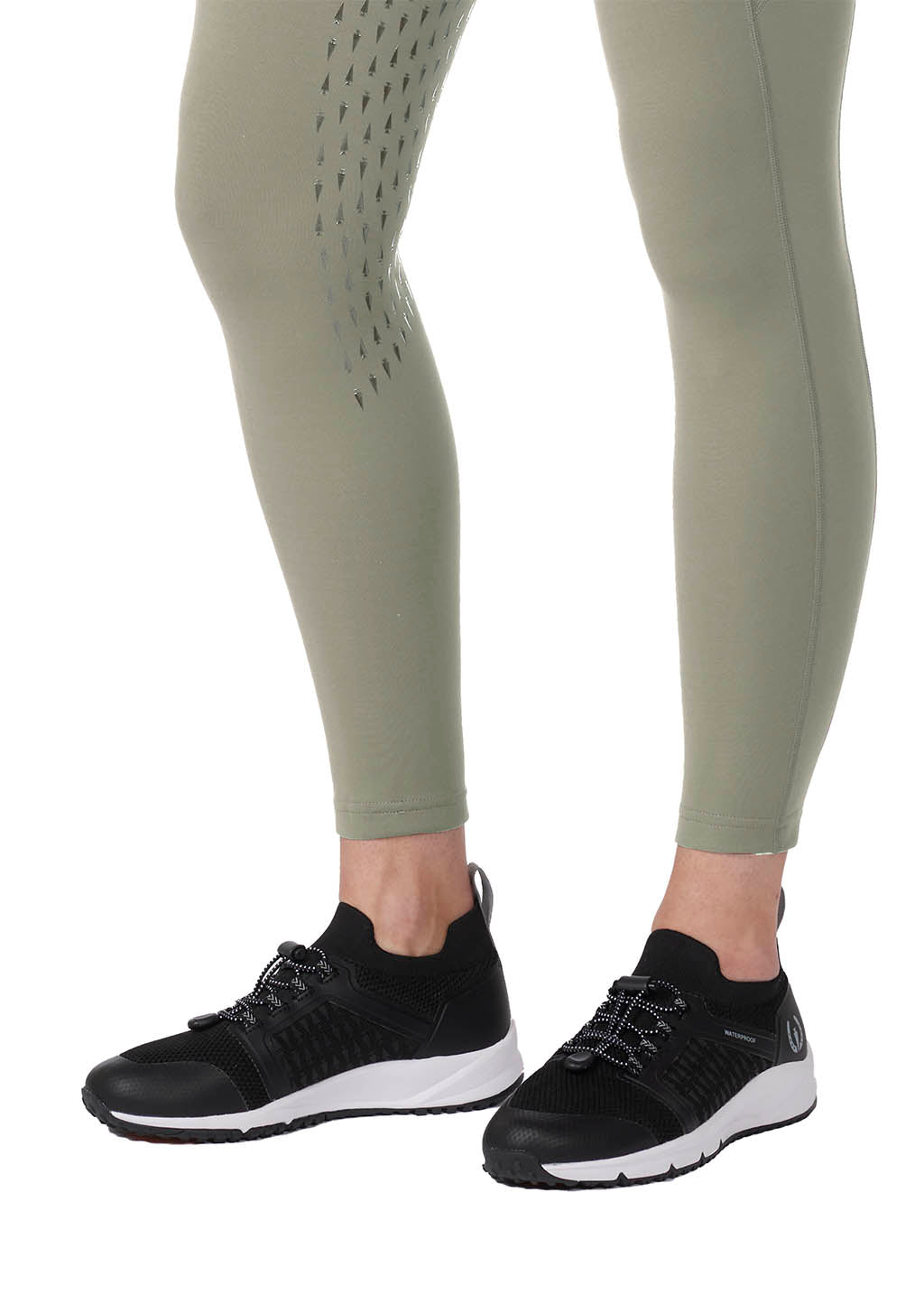 Close-up of the Kerrit Sticks™ silicone full-leg grip on the Coolcore® Full Leg Tech Tight, providing breathable grip from inner thigh to calf.