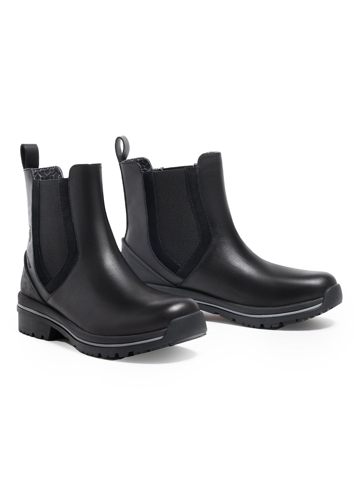 Flat lay of the Coachella Pull On Waterproof Barn Boot in Black, showcasing the buttery-soft Nappa leather and functional elastic gore.
