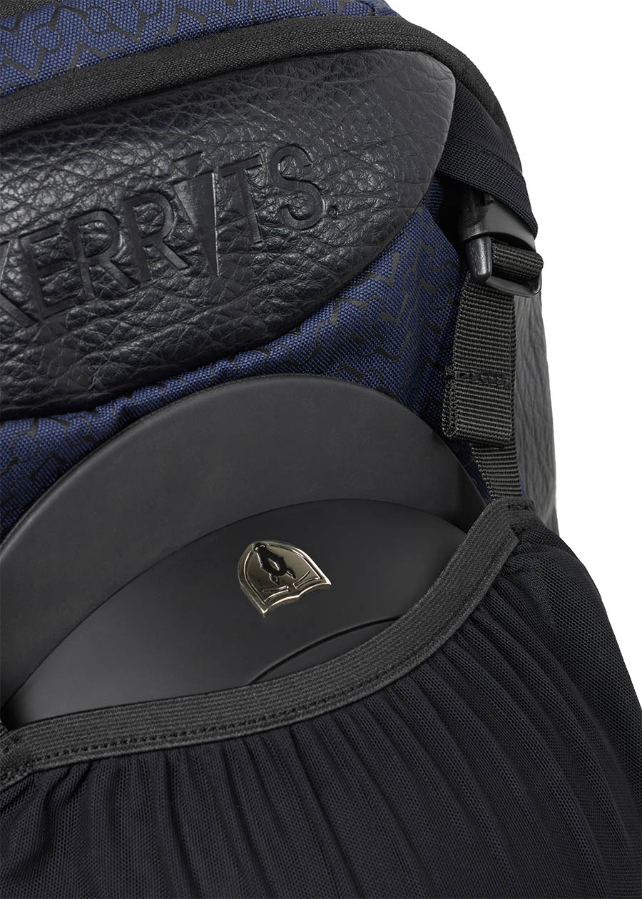 Close-up of the Kerrits EQ Backpack fabric in Navy, emphasizing the high-quality craftsmanship and branding.