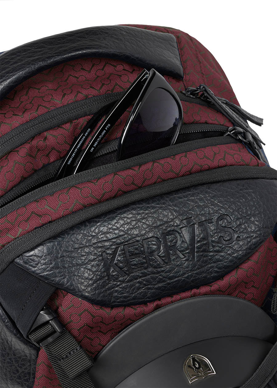 Top view of the Kerrits EQ Backpack in Burgundy, showing the sturdy handle and zippered main compartment.