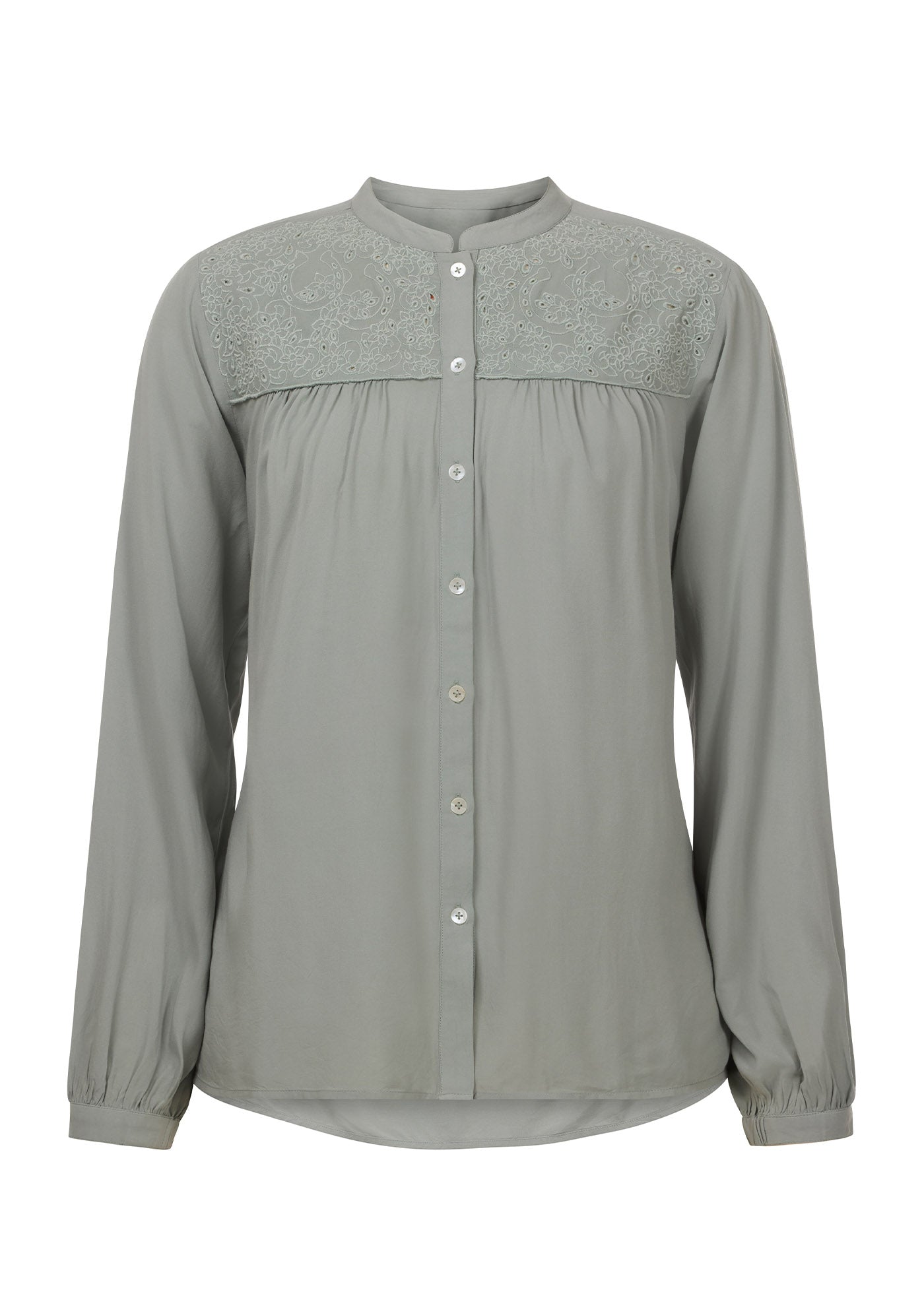 Flat lay of the Kerrits Hollyhocks & Horseshoes Blouse in Celadon, showing the front profile with floral horseshoe embroidery.