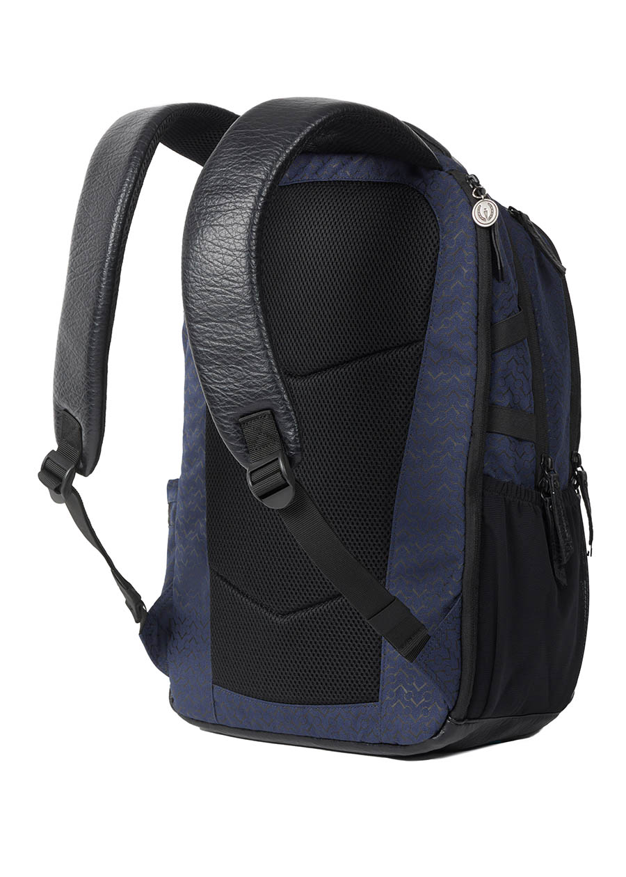 Flat lay of the Kerrits EQ Backpack in Navy, showing the padded back panel and adjustable straps.