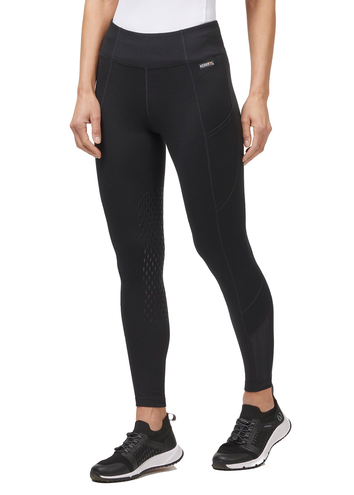 Front-side view of the Free Style Knee Patch Pocket Tight in Black, displaying the ergonomic fit and side pocket placement.