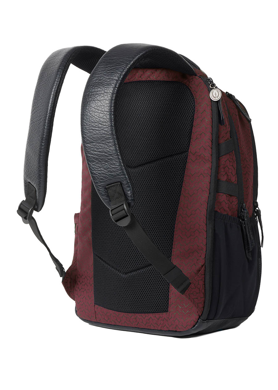 Flat lay of the Kerrits EQ Backpack in Burgundy, showing the padded back panel and adjustable straps.