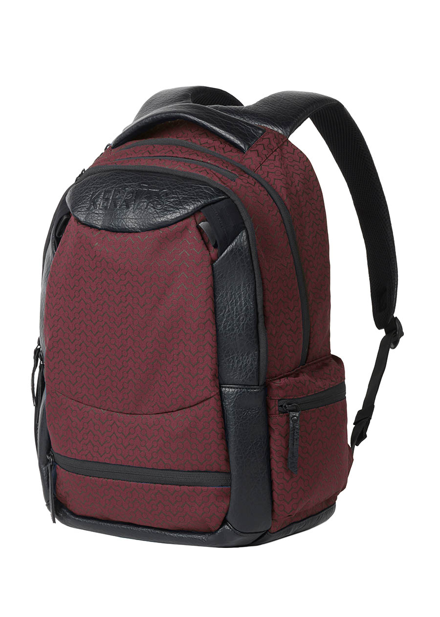 Flat lay of the Kerrits EQ Backpack in burgundy, presenting the front design with organized compartments.