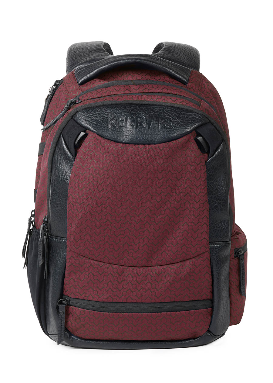 Front view of the Kerrits EQ Backpack in burgundy, showcasing its equestrian-inspired design with multiple storage compartments.