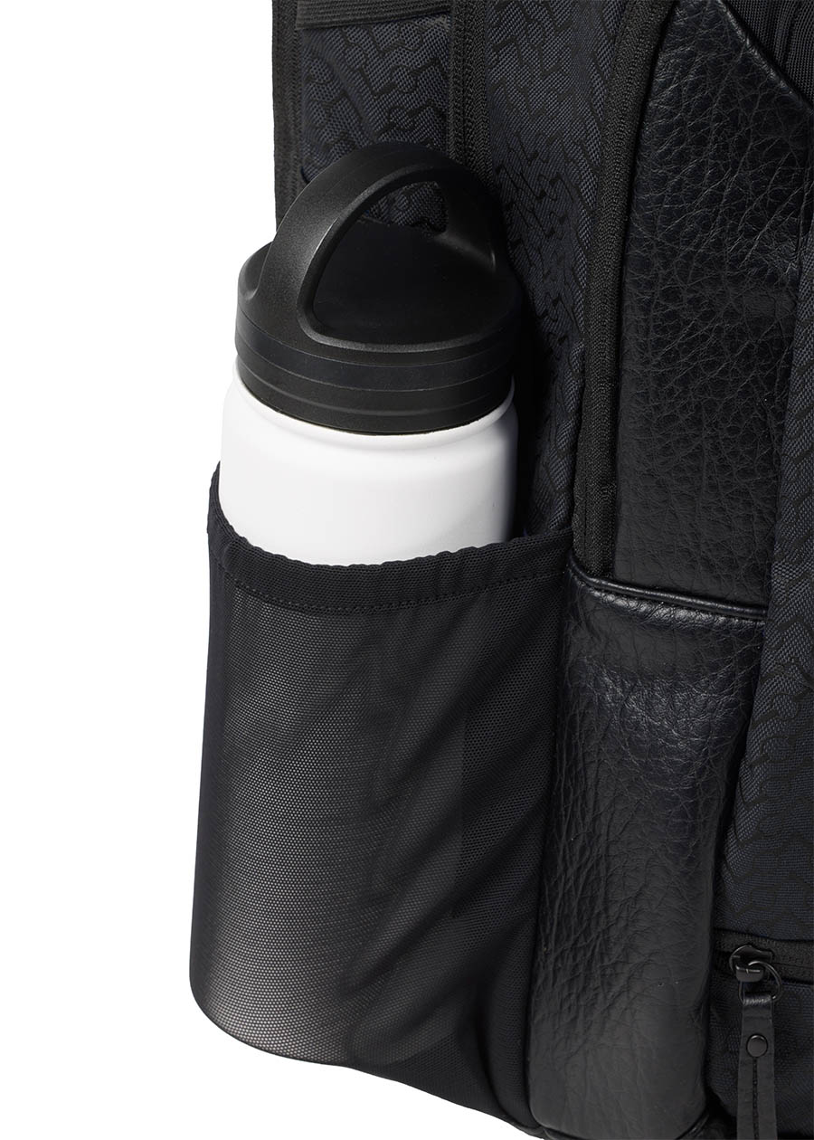 Close-up of the Kerrits EQ Backpack, showing the side mesh bottle compartment to make sure you stay hydrated.