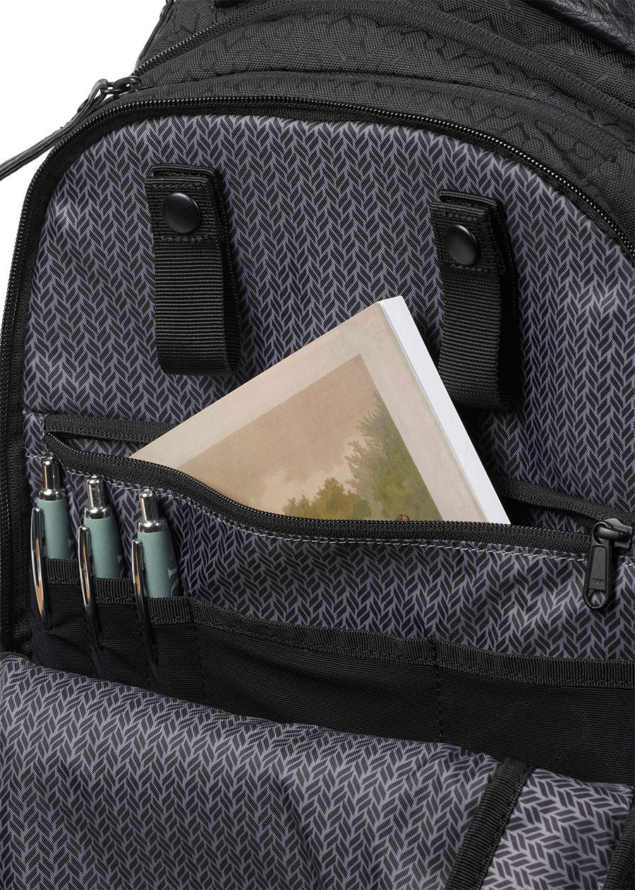 Detailed view of the Kerrits EQ Backpack fabric, highlighting roomy interior, large zip pocket and pen holders."
