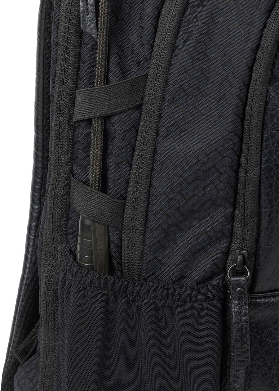 Detailed view of the side of Kerrits EQ Backpack fabric, highlighting the riding crop holder.