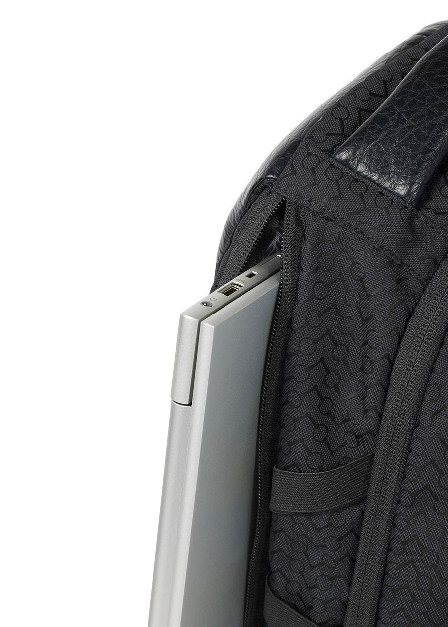 Side view of the Kerrits EQ Backpack, displaying the streamlined silhouette and additional side laptop pockets.