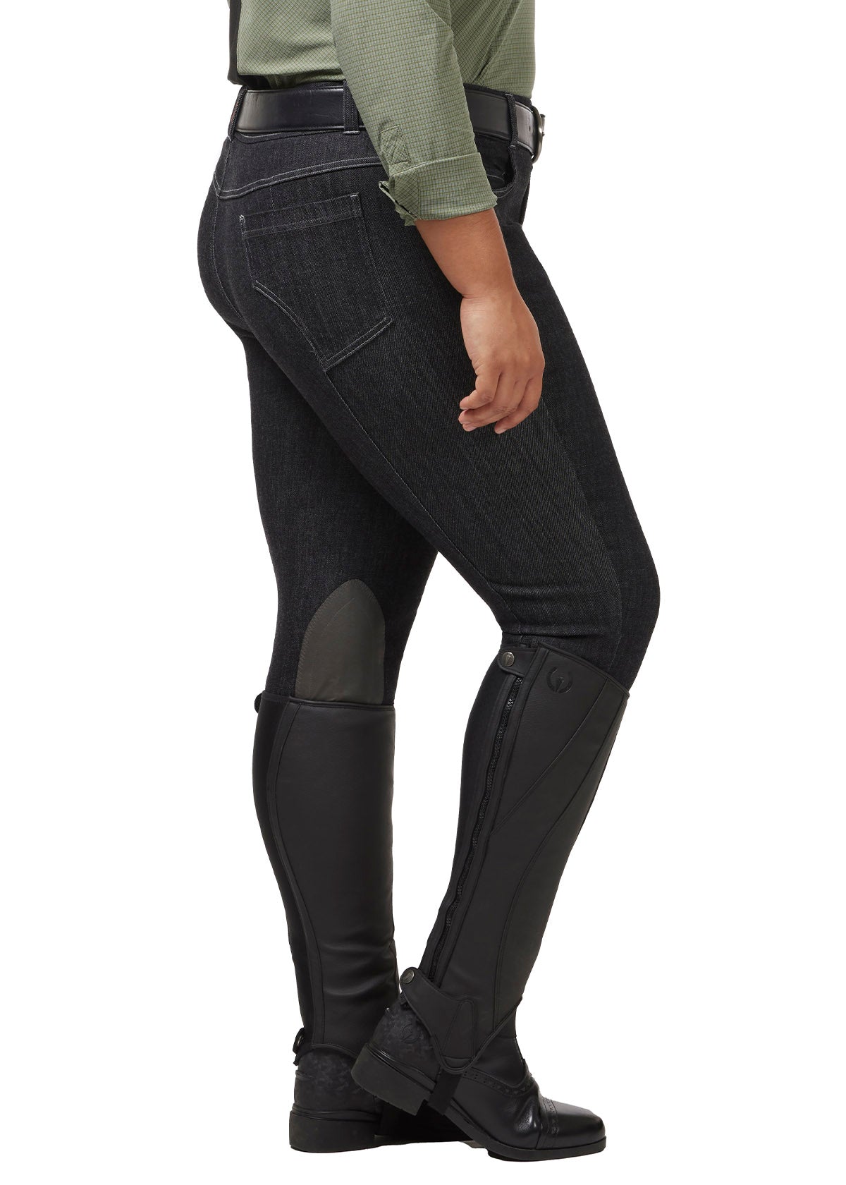 Side view on model of the Stretch Denim Knee Patch Breech in charcoal, showcasing the GripSoft™ knee patches that provide flexible grip for enhanced riding performance