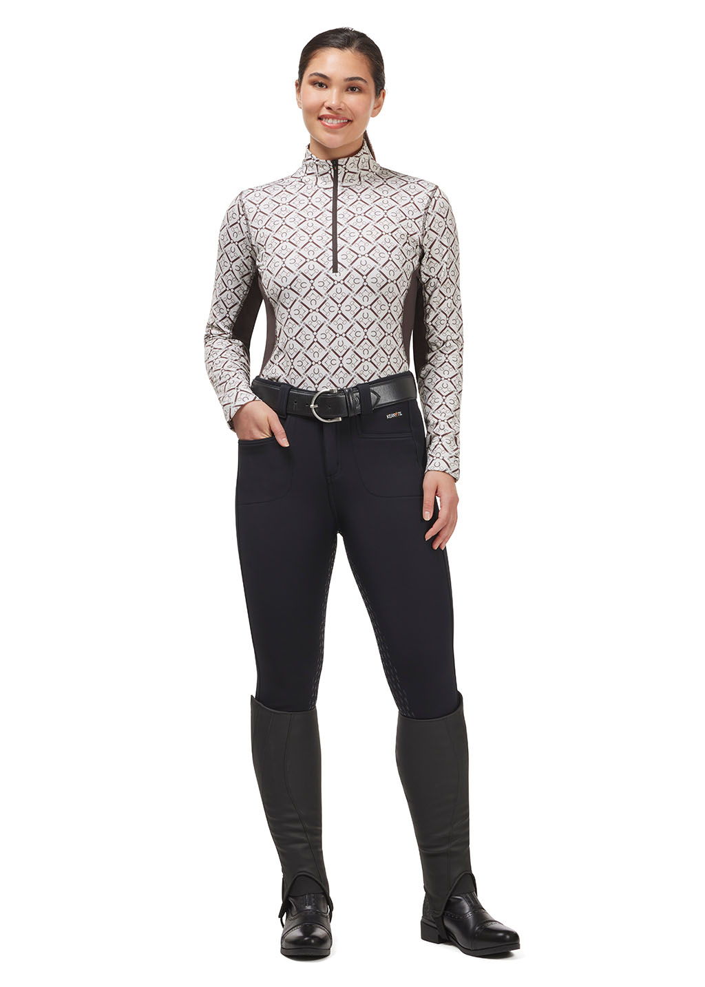 Model wearing black 3-Season Tailored Full Seat Riding Breech and a long sleeve riding top in a cream, showing how to put together a full look.