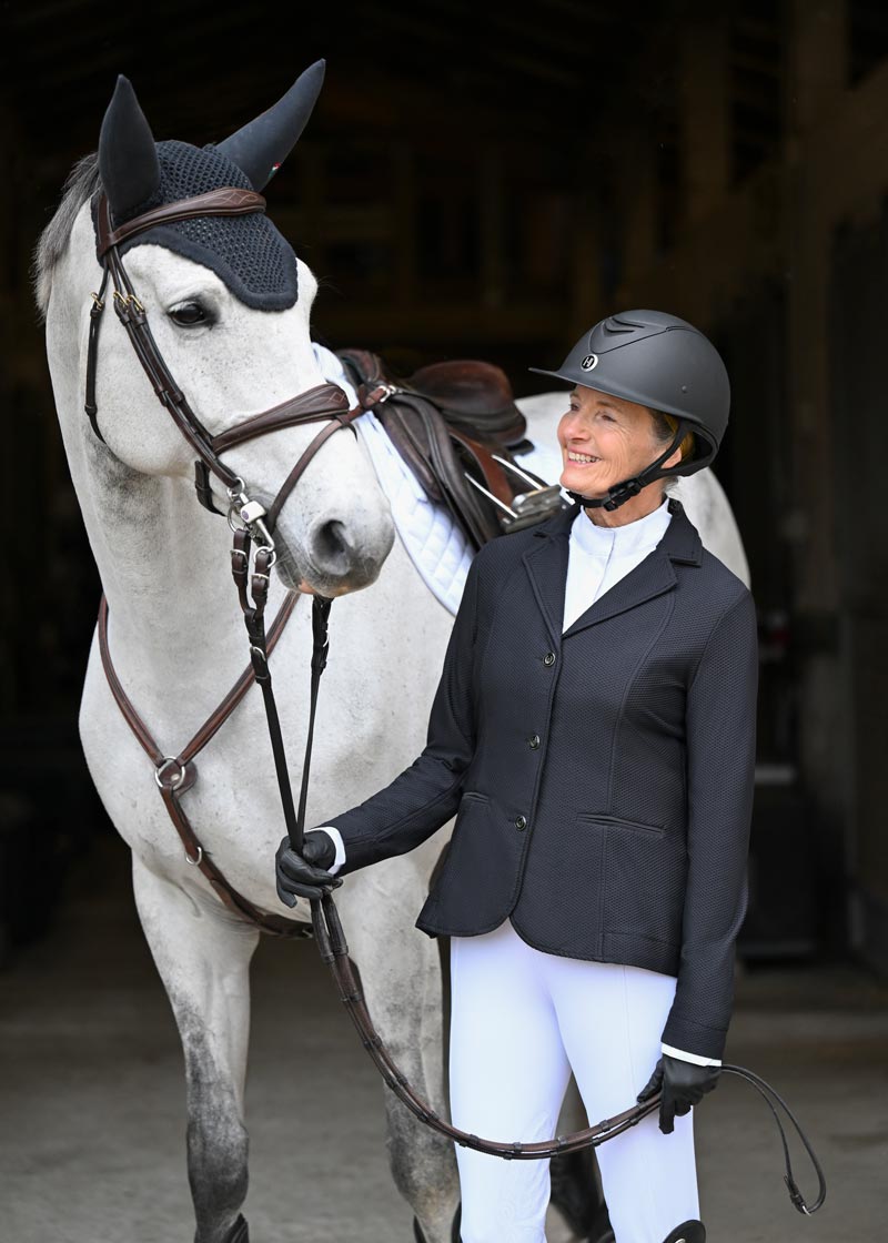 Rider pairing the coat with coordinating show attire, showcasing a complete competition outfit