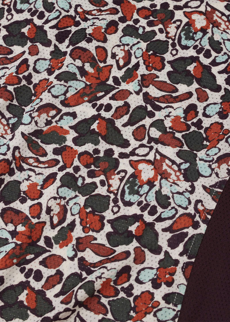 Close-up of the Ice Fil® Lite fabric on the Breeze Long Sleeve Shirt in Terracotta Springtime Print, showing its breathable, quick-drying, and cooling properties.