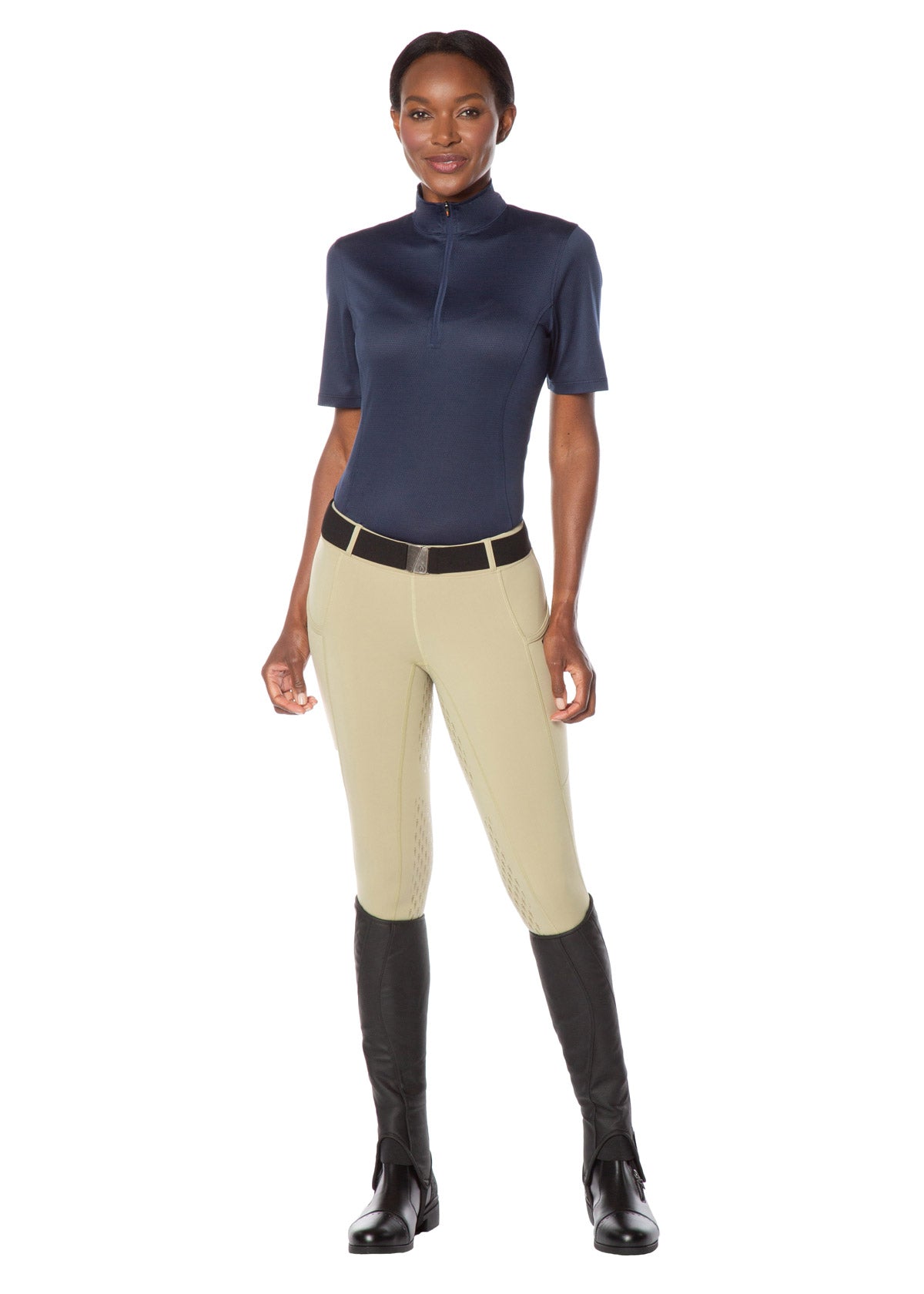 Model wearing the Kerrits Ice Fil® Lite Short Sleeve Riding Shirt in Navy, paired with tan riding tights.