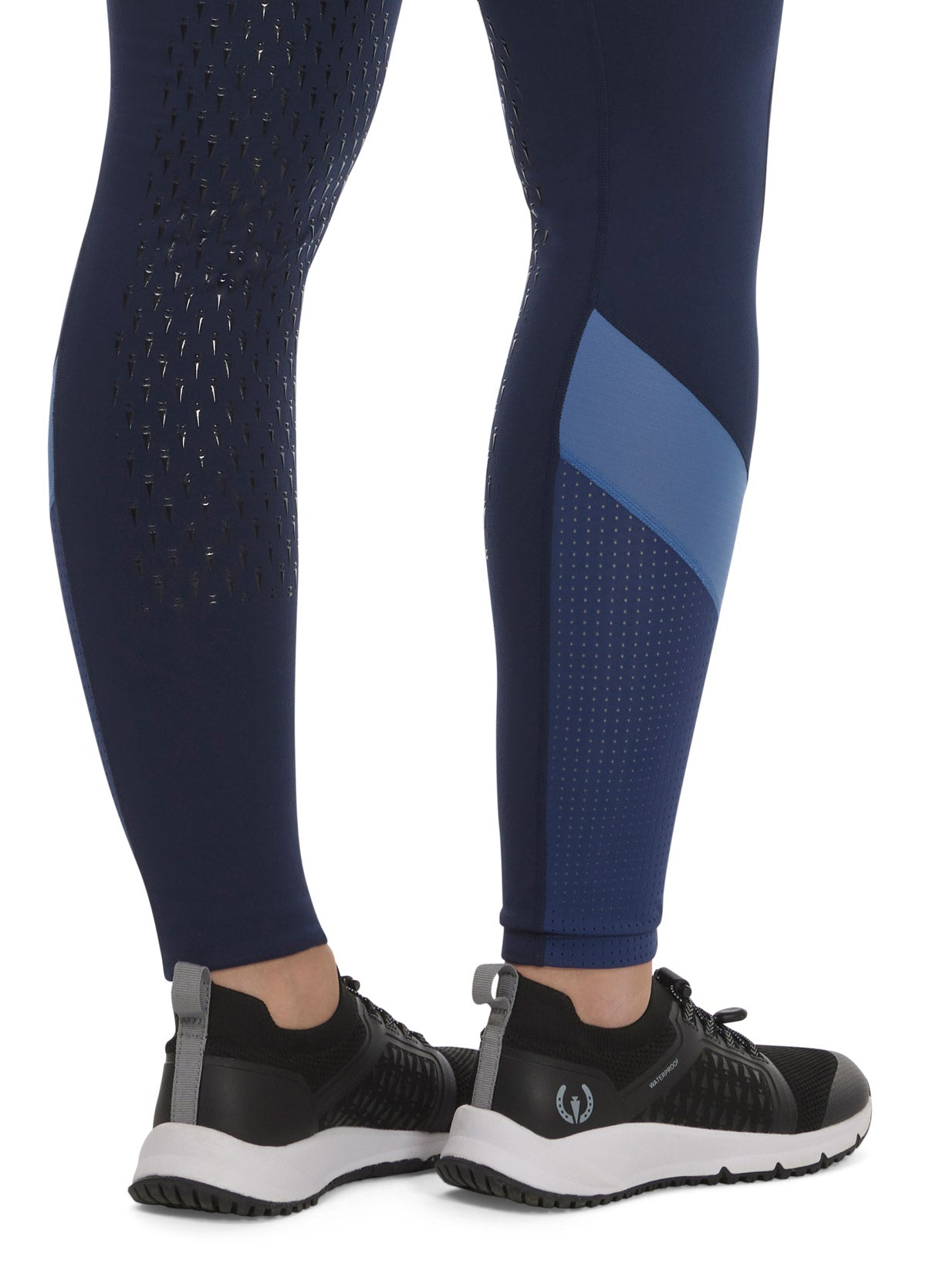 Close-up of the Free Style Knee Patch Pocket Tight in Galaxy Blue, focusing on the knee patch and mesh panel details.