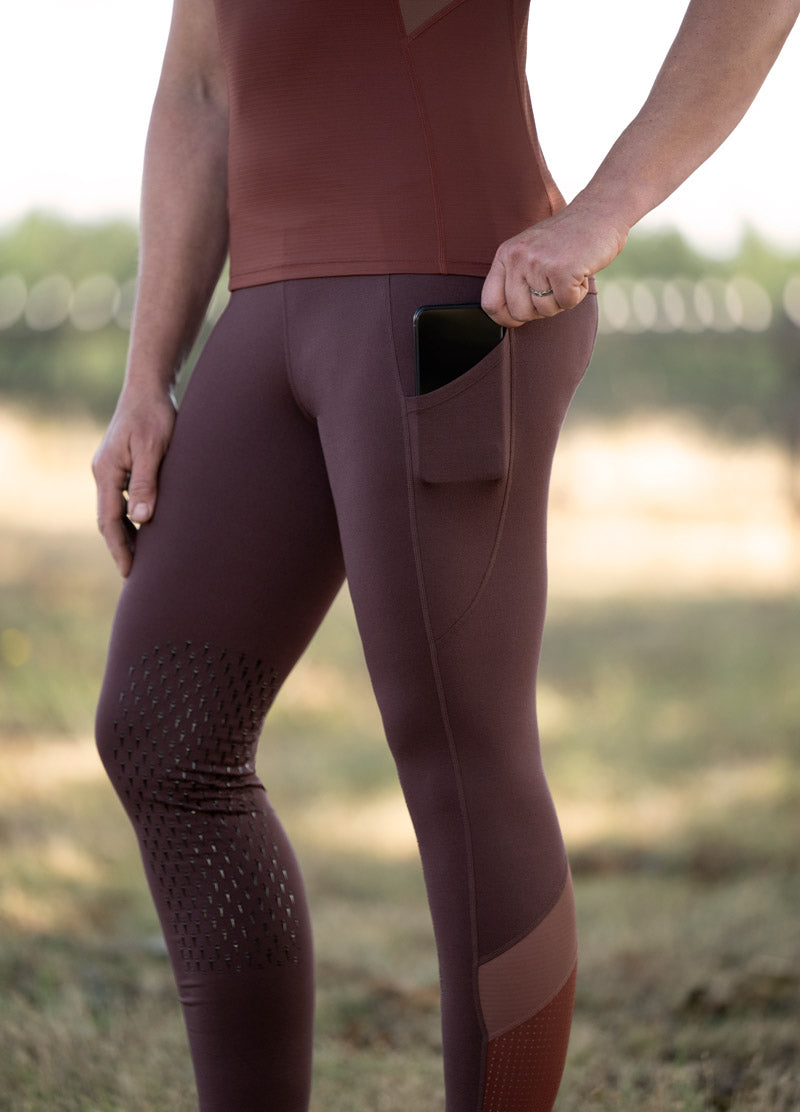 Close-up of the side pocket on the Free Style Knee Patch Pocket Tight in Redwood/Sedona, designed for easy access to essentials.