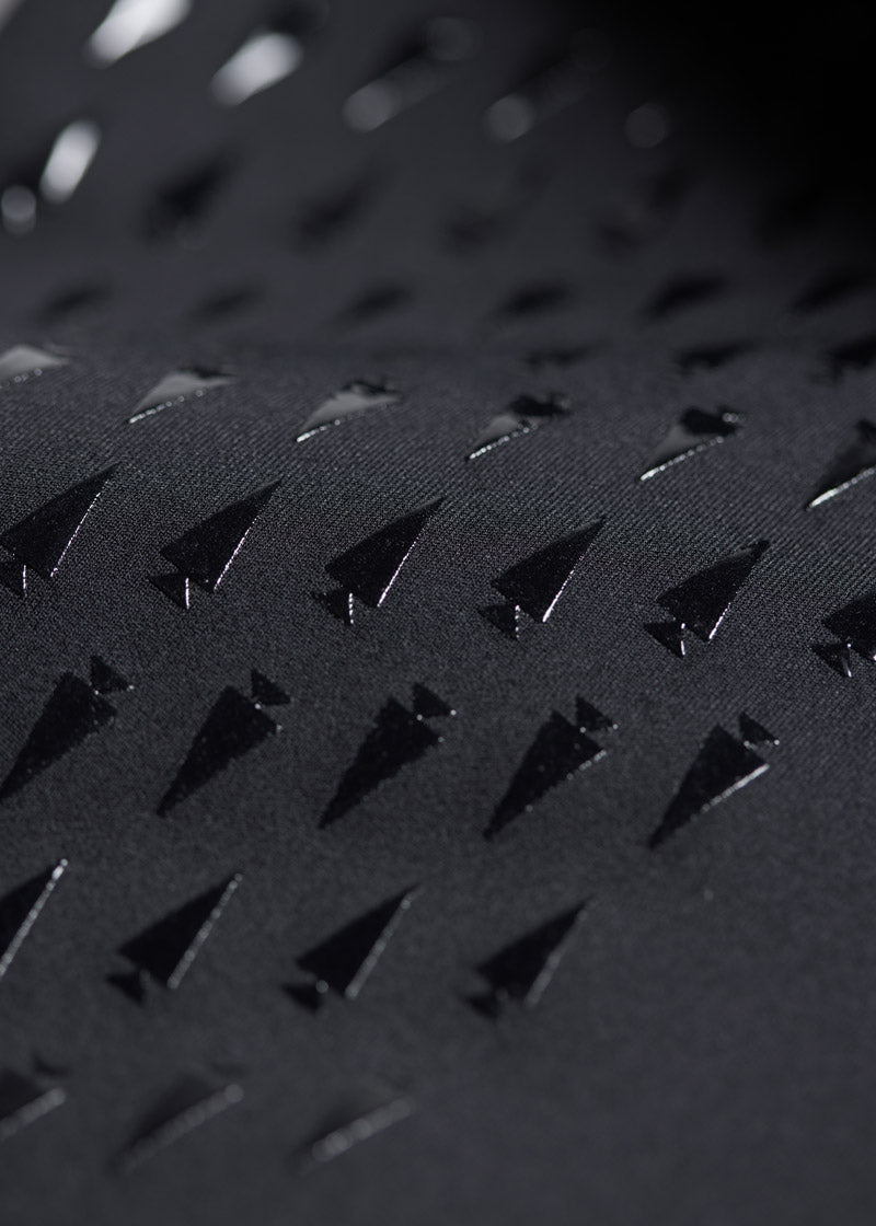 Close-up of the Coolcore® Stretch Interlock fabric of the Coolcore® Full Leg Bootcut Riding Tight - Tall, highlighting its moisture-wicking and cooling properties.