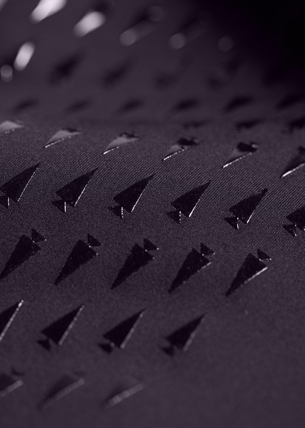 Close-up of the Kerrit Sticks™ silicone full-leg grip on the Coolcore® Full Leg Tech Tight, providing breathable grip from inner thigh to calf.