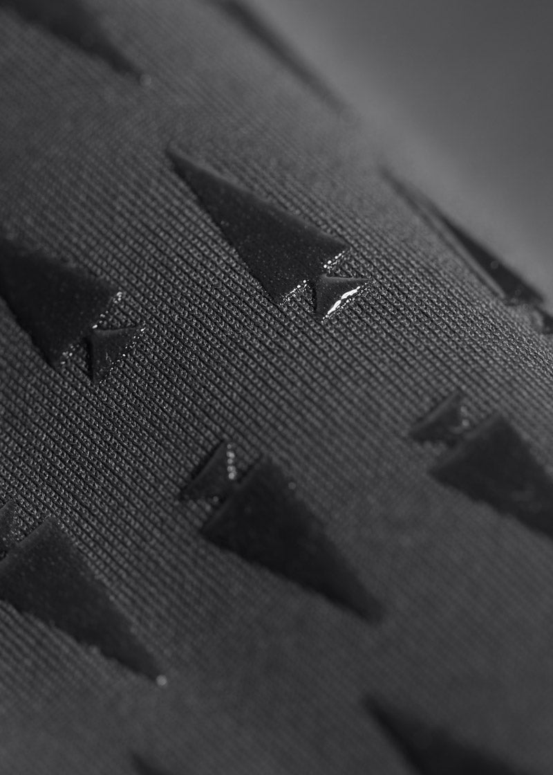 Close-up of the Kerrit Sticks™ silicone full-leg grip on the Coolcore® Full Leg Tech Tight, providing breathable grip from inner thigh to calf.