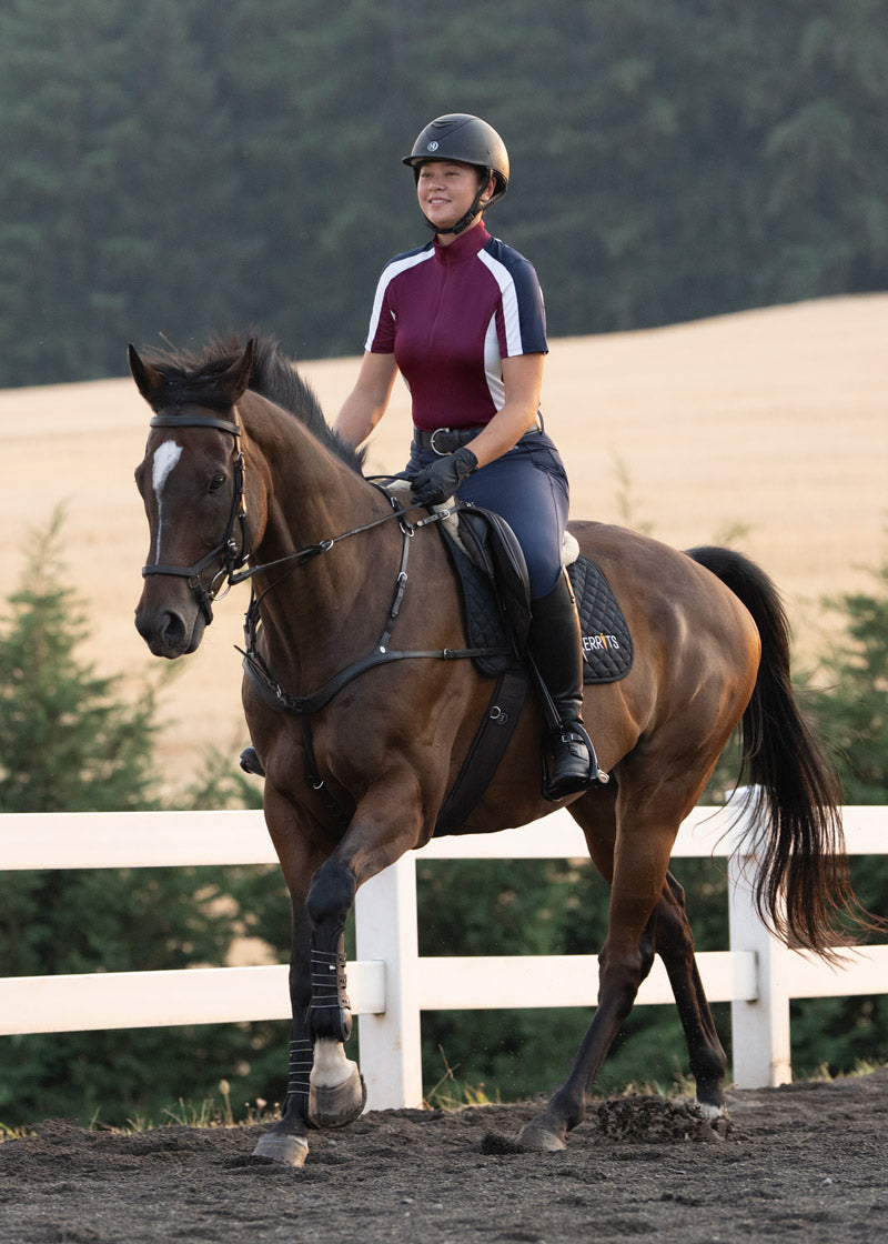Equestrian cantering in the Kerrits K-Flex™ Knee Patch Breech, showcasing performance-ready knee patch grip.