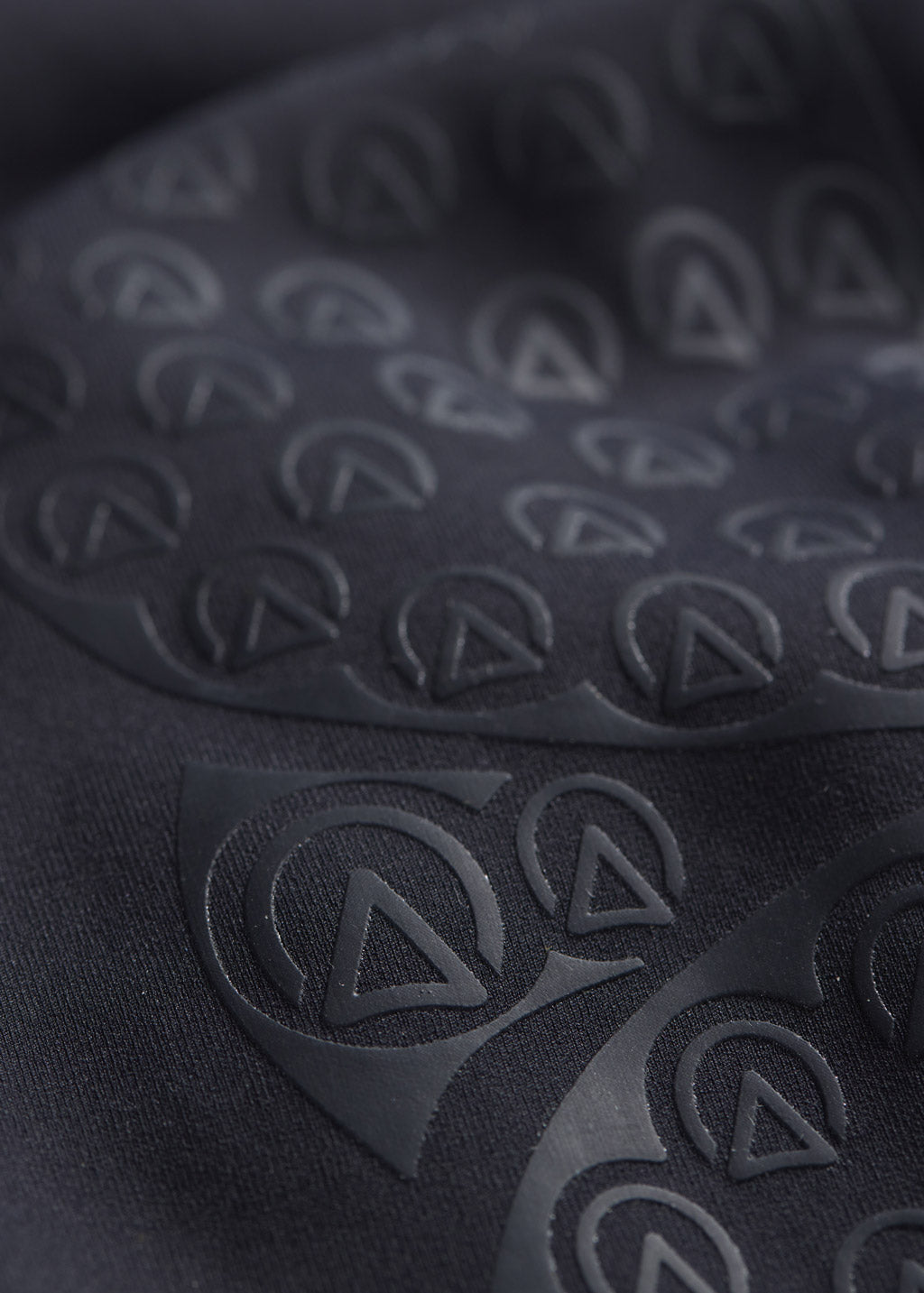 Detailed view of the Affinity® Silicone knee patch on the tight, providing flexible, breathable grip.