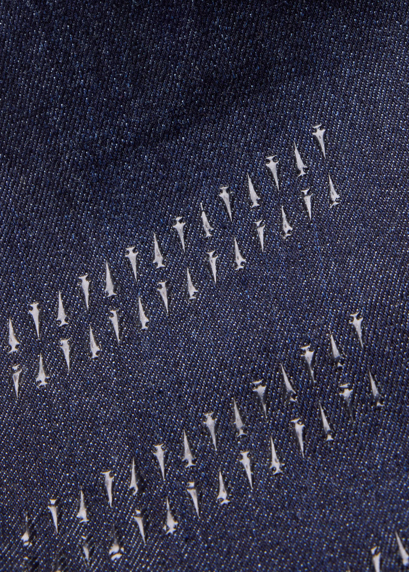 Close-up of the silicone knee patches, emphasizing the extended grip that extends to the ankle for enhanced stability