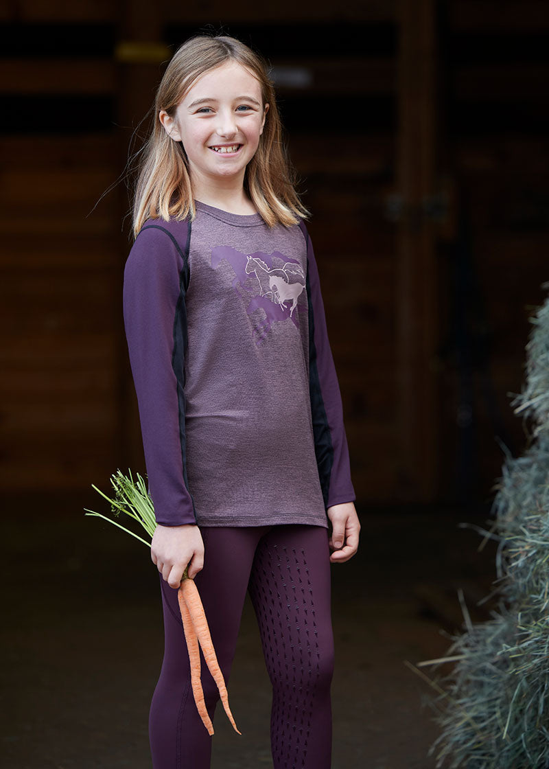 Child wearing the top while engaging in outdoor activities, showcasing its versatility and stylish appearance