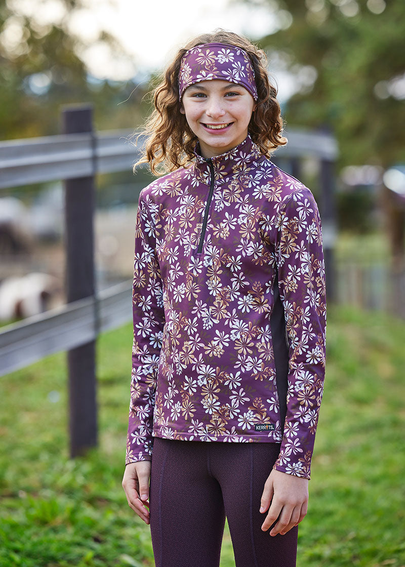 Child wearing the fleece top while engaging in outdoor activities, showcasing its versatility and stylish appearance
