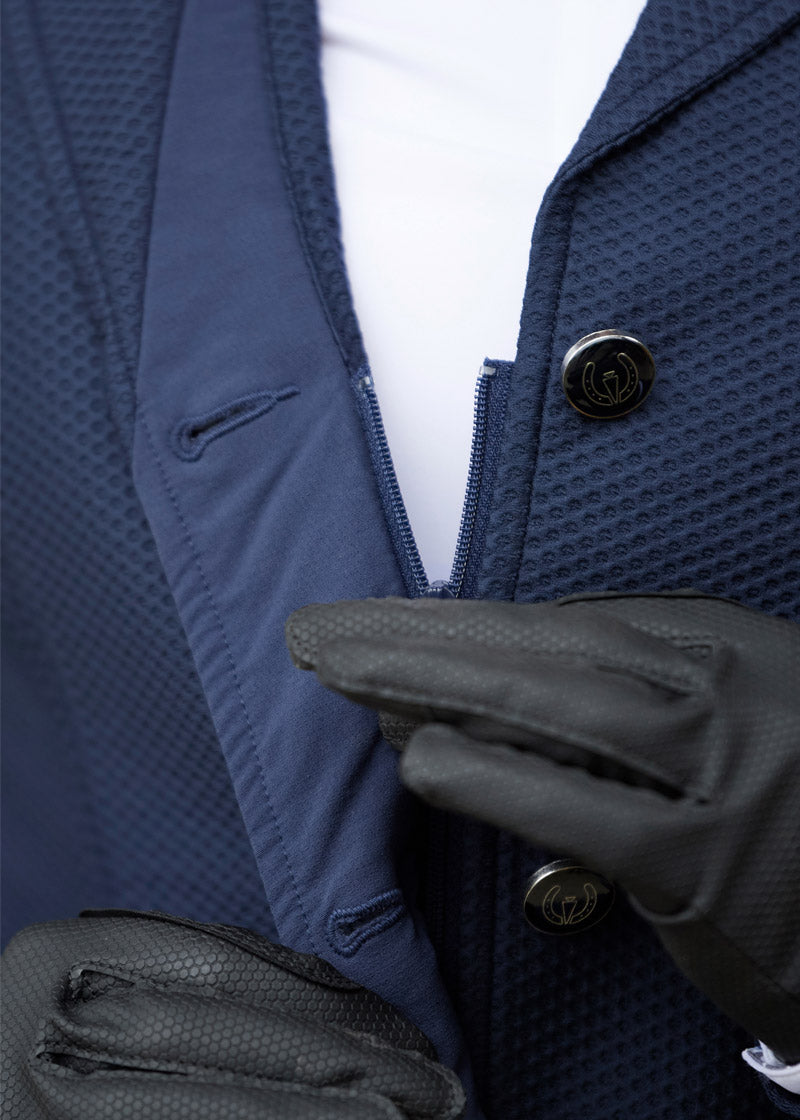 Close-up of the Kerrits Kids Affinity Aero Show Coat in navy, featuring a crisp collar and three-button front closure, all crafted from textured Aero Mesh fabric