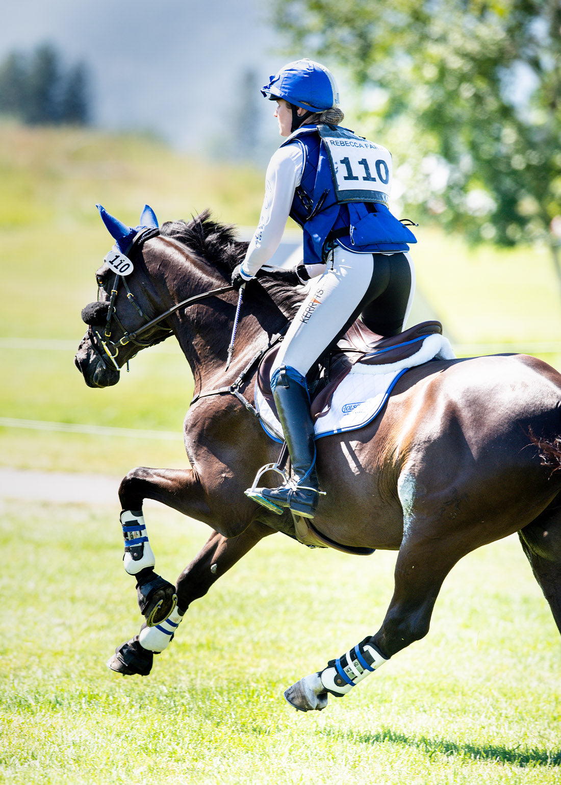 Equestrian wearing the GripTek™ full seat during an eventing competition, ensuring security and stability.