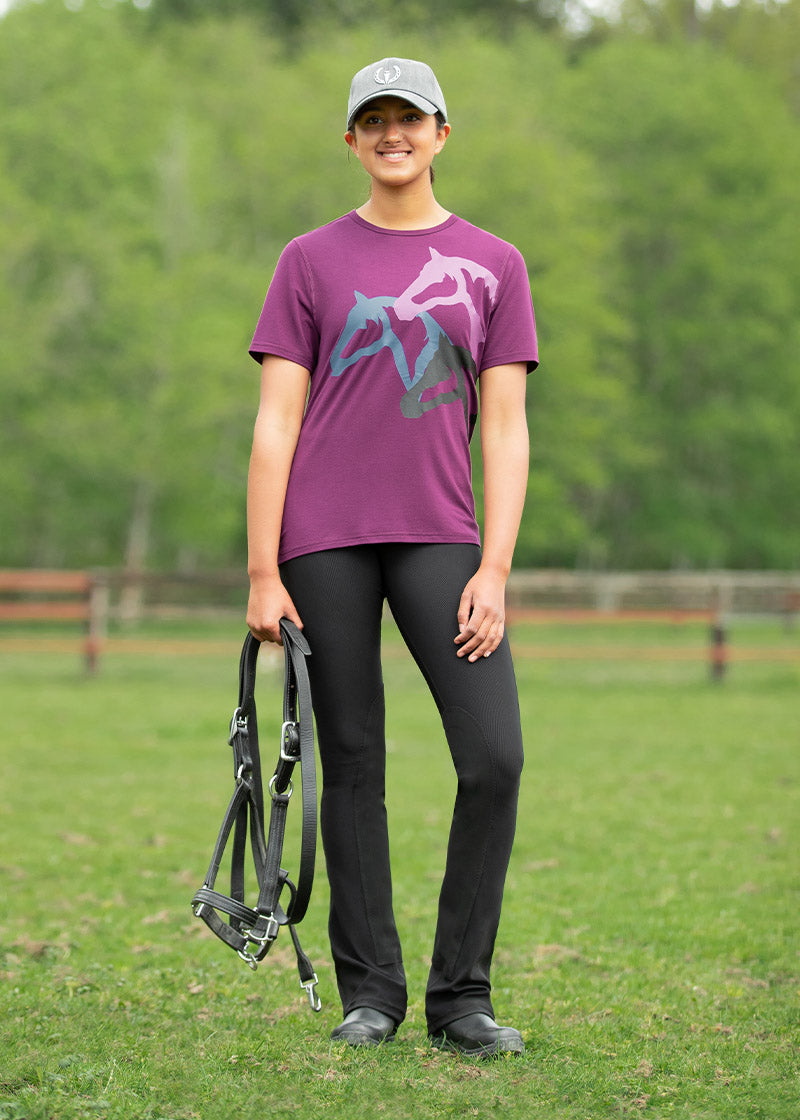Person wearing the Microcord™ Knee Patch Pocket Tight with a casual tee and boots, demonstrating versatility for post-ride errands.