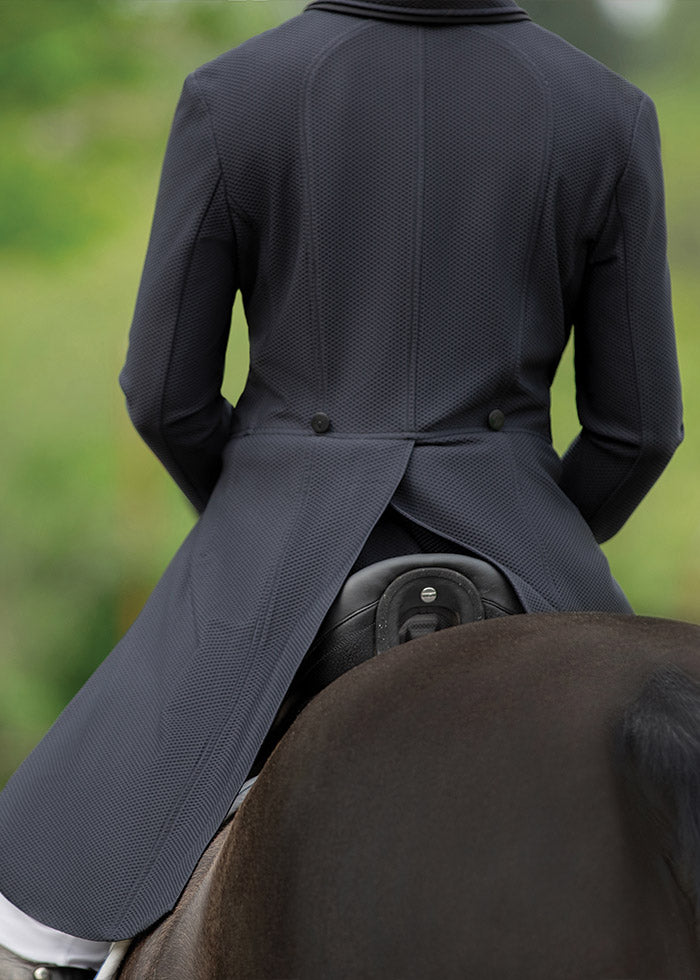 Rider on horse showcasing the back of the black Affinity® Aero Shadbelly Show Coat, with flowing tails and a tailored fit.
