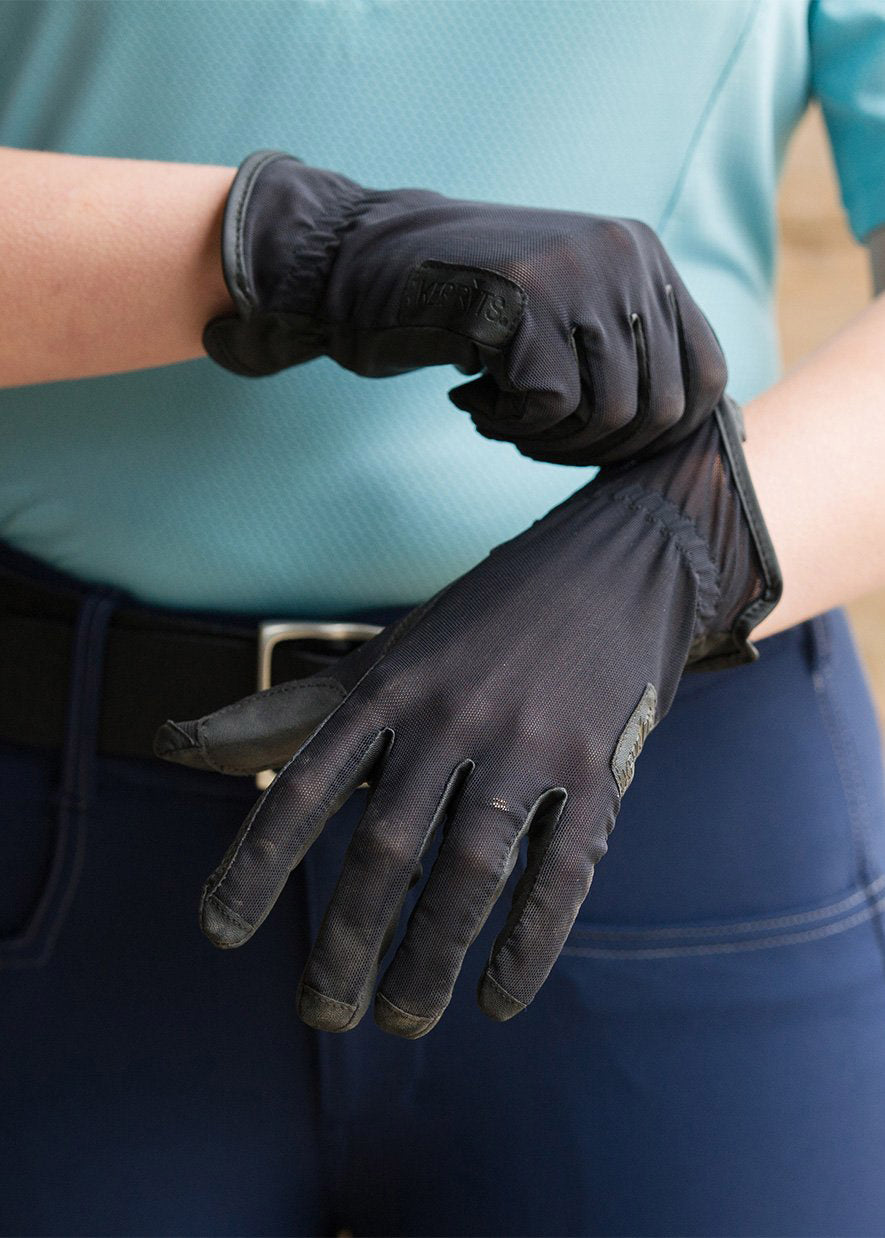 Person adjusting the gloves, emphasizing their easy pull-on styling