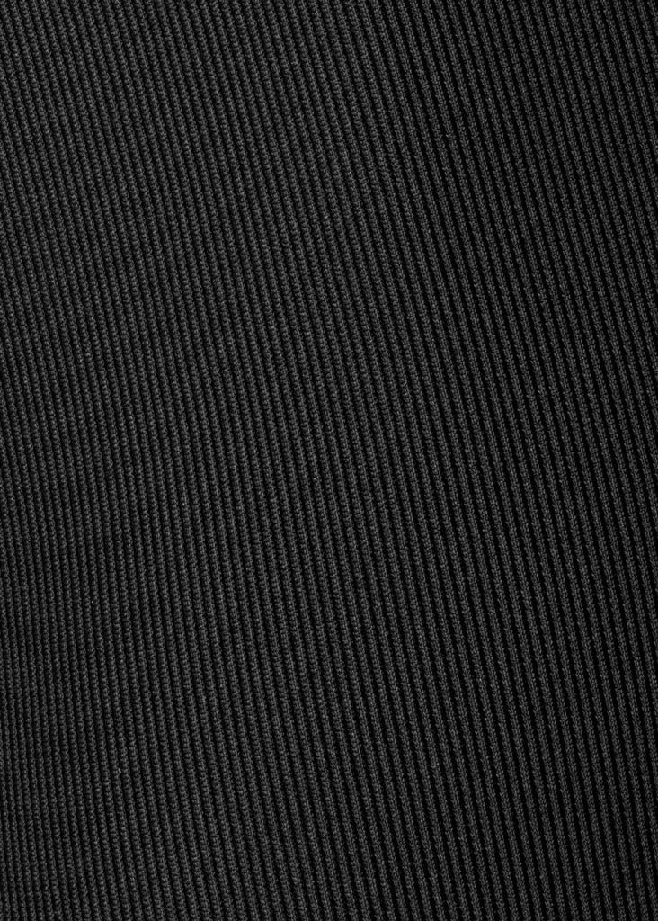 Detailed shot of the ribbed Microcord™ fabric, highlighting its four-way stretch and compression qualities that offer muscle support and shape retention
