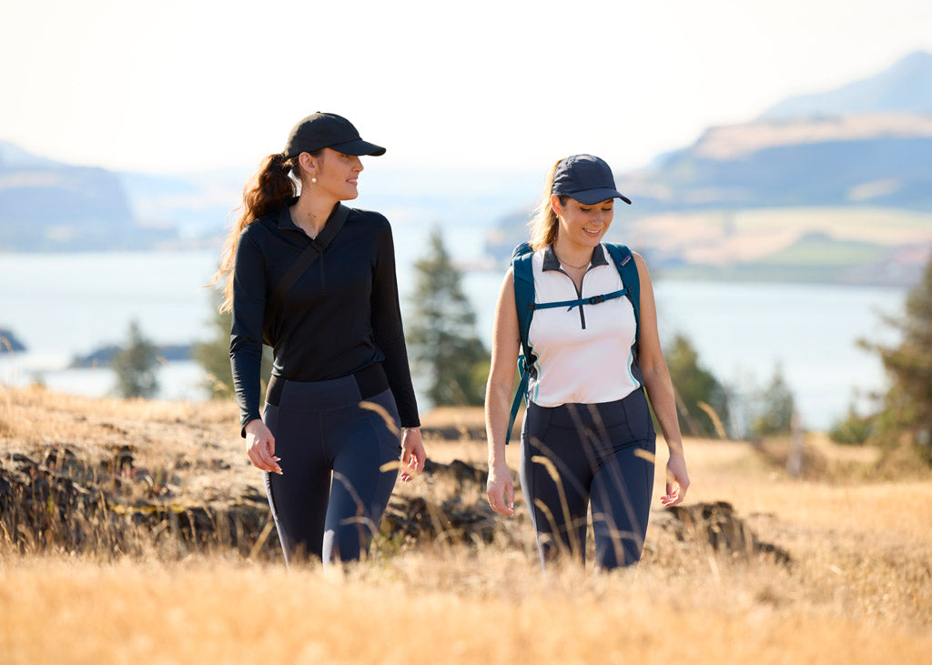 Two women hiking in the pacific northwest while wearing Kerrits activewear