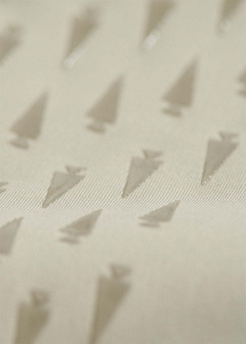 Close-up of the Coolcore® Stretch Interlock fabric, emphasizing its chemical-free fibers engineered to manage and quickly distribute moisture and body heat through thermo-controlled evaporation
