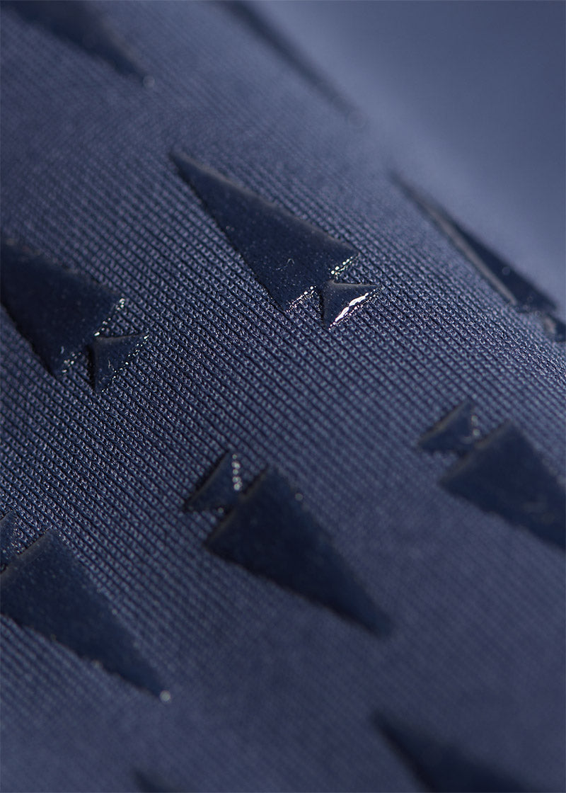 Close-up of the Coolcore® Stretch Interlock fabric, emphasizing its chemical-free fibers engineered to manage and quickly distribute moisture and body heat through thermo-controlled evaporation