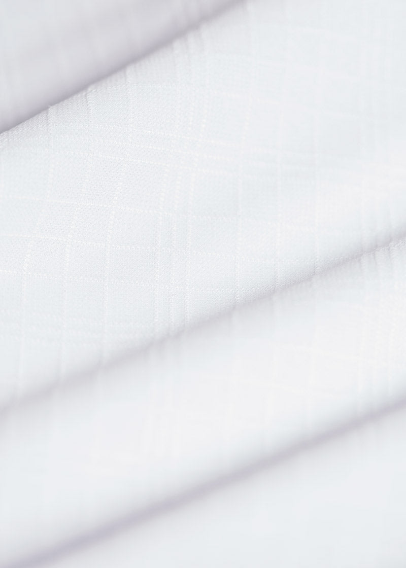 Close-up of the Ice Fil® Diamond Tech fabric on the Encore Long Sleeve Show Shirt, illustrating its textured pattern and cooling properties.