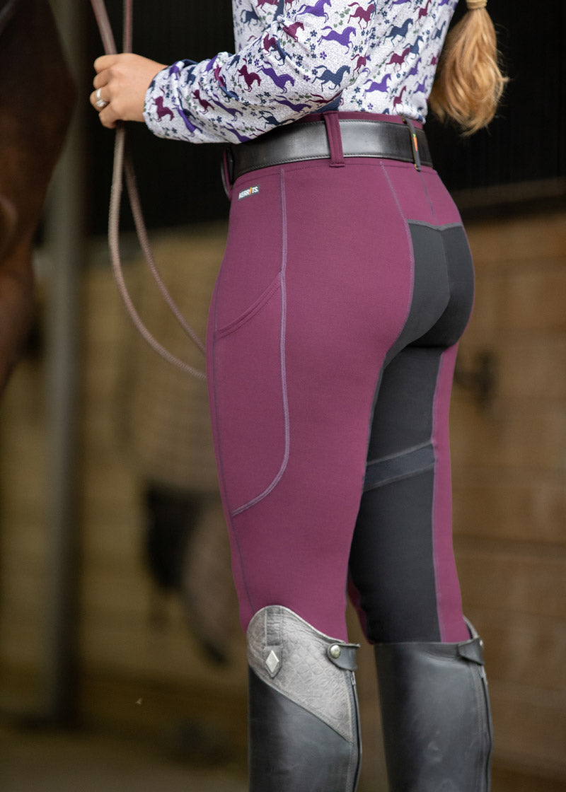 Side view of the Kerrits Flex 3.0 Full Seat Tight in Raisin, showing the pocket and articulated full seat.