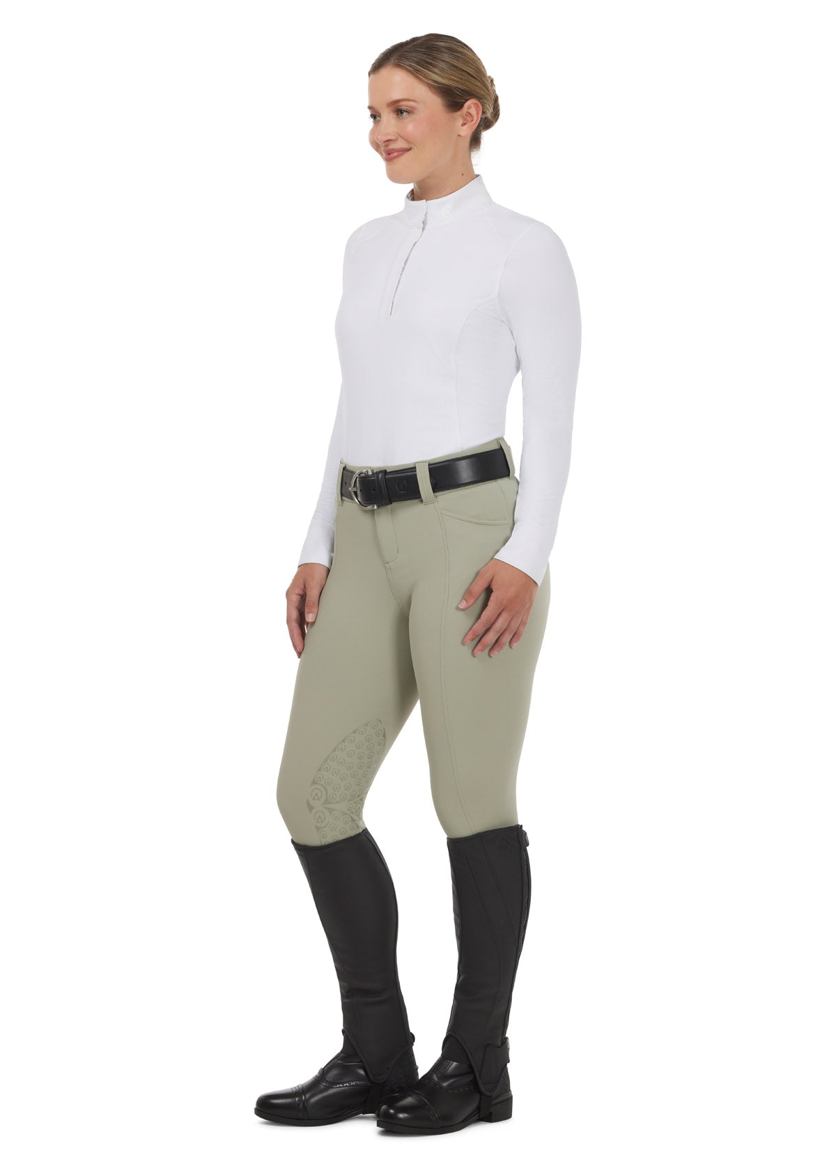 Model wearing a white Affinity Pro Long Sleeve Equestrian Show Shirt, shown paired with tan breeches, emphasizing a polished competition look.