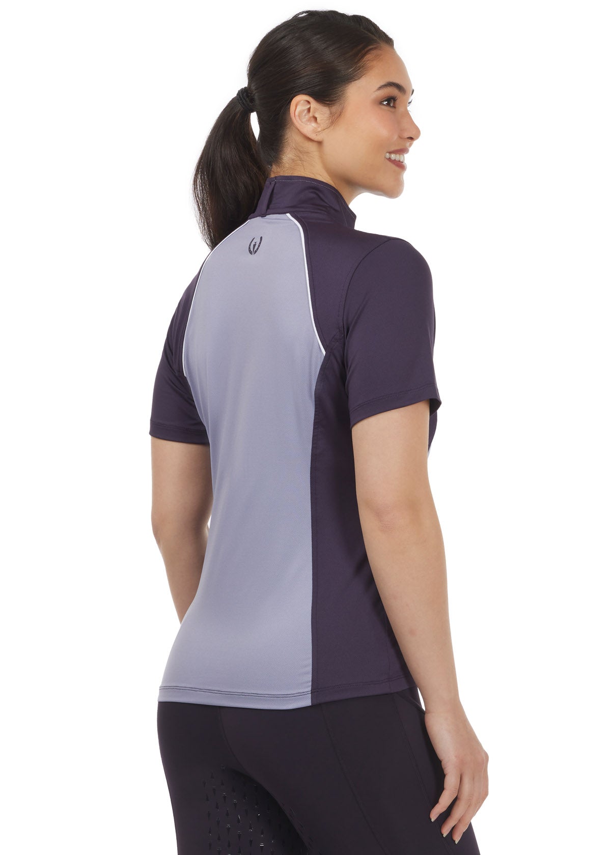 Side view of the Charisma Coolcore Short Sleeve Riding Shirt in Silverberry, highlighting the feminine silhouette and equestrian-shaped hem for added functionality.
