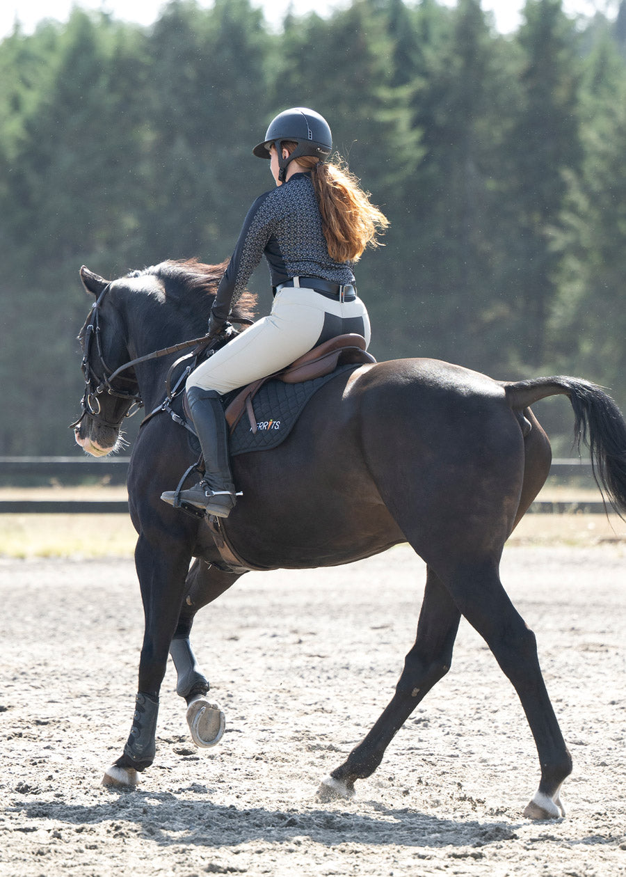 Rider wearing the Breeze Ice Fil® Long Sleeve Riding Shirt during a summer ride, showcasing its cooling and wicking properties.