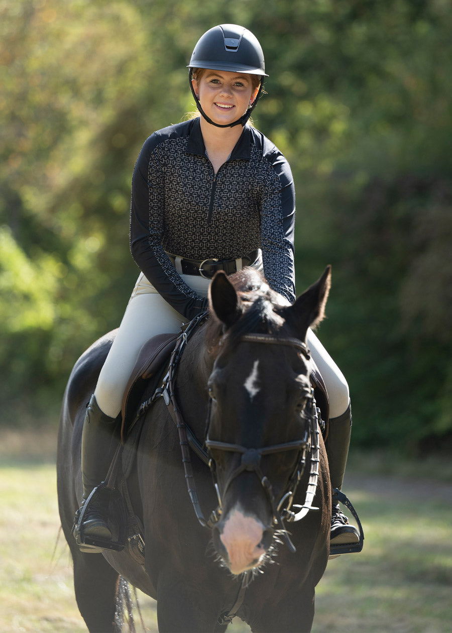 Rider enjoying a trail ride in the Breeze Ice Fil® Long Sleeve Riding Shirt, highlighting its UPF+30 sun protection and breathable design.