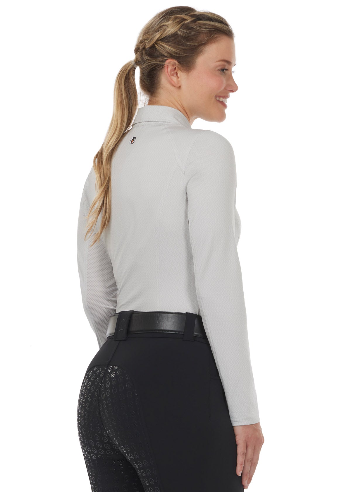ack view of the Kerrits In a Snap Long Sleeve Equestrian Clinic Shirt in Opalmist, tucked into a pair of black breeches.