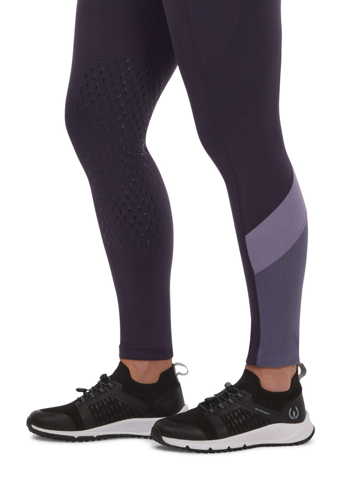 Close-up of the Free Style Knee Patch Pocket Tight in plumnoir, focusing on the knee patch and mesh panel details.