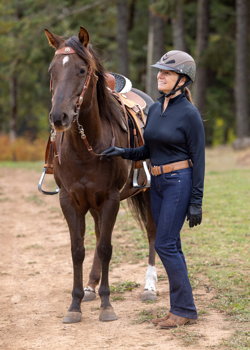 Rider pairing the pants with boots and a riding top, showcasing a complete equestrian outfit